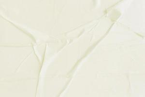 Blank cream paper is crumpled texture background. Crumpled paper texture backgrounds for various purposes photo