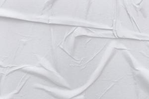 Blank white paper is crumpled texture background. Crumpled paper texture backgrounds for various purposes photo