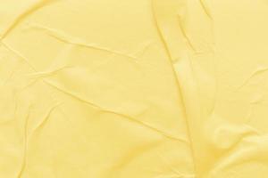 Blank yellow paper is crumpled texture background. Crumpled paper texture backgrounds for various purposes photo