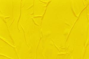 Blank yellow paper is crumpled texture background. Crumpled paper texture backgrounds for various purposes photo