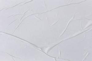 Blank white paper is crumpled texture background. Crumpled paper texture backgrounds for various purposes photo