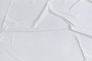 Blank white paper is crumpled texture background. Crumpled paper texture backgrounds for various purposes photo