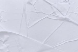 Blank white paper is crumpled texture background. Crumpled paper texture backgrounds for various purposes photo