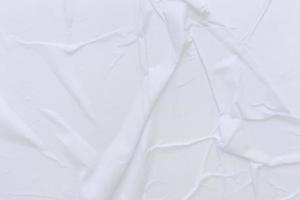 Blank white paper is crumpled texture background. Crumpled paper texture backgrounds for various purposes photo
