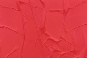 Blank red paper is crumpled texture background. Crumpled paper texture backgrounds for various purposes photo