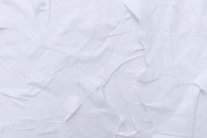 Blank white paper is crumpled texture background. Crumpled paper texture backgrounds for various purposes photo