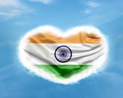 Indian flag in heart shape on blue sky photo