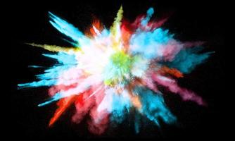 Colorful powder explosion, isolated on black background