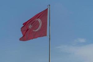 Turkish flag in blue sky background photo