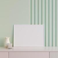 Modern and minimalist horizontal white poster or photo frame mockup on the table in the living room. 3d rendering.