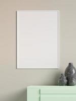 Modern and minimalist vertical white poster or photo frame mockup on the wall in the living room. 3d rendering.