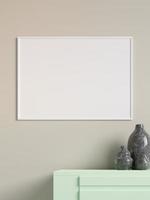 Modern and minimalist horizontal white poster or photo frame mockup on the wall in the living room. 3d rendering.
