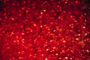 Space abstract background. Christmas backdrop. Texture of red shiny crystals. photo