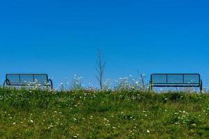 2 benches on a dike photo