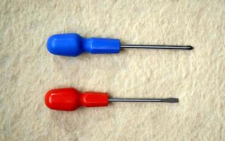 two screwdrivers with a red and blue handles photo