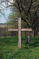 Old cross in the cemetery photo