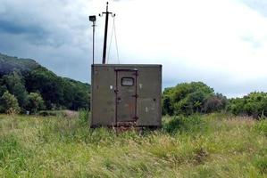 iron booth and concrete pillar photo