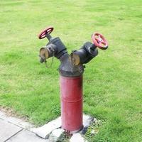 Hydrant with water hoses and fire extinguish equipment photo