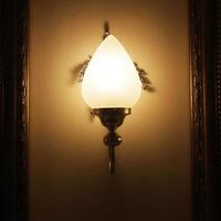 Wall lamp with a shade on the background photo