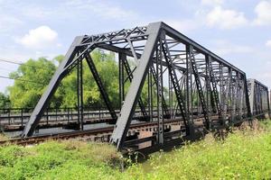 Iron railway bridge over the river photo