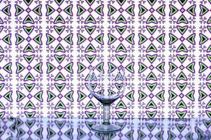 glass wine glass on the background of crosses photo
