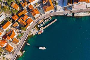 Aerial Panoramic view of the harbor and ships of the historic town of Perast in Kotor Bay in Montenegro photo