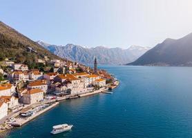 Aerial Panoramic view of Perast historic old town in Kotor Bay during a sunny spring day, Montenegro