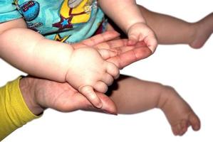 hand of a child and an adult photo