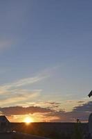 Evening sunset with blue and yellow clouds photo