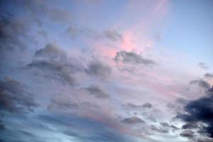 Evening sunset with blue and yellow clouds photo