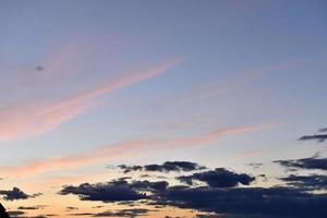 Evening sunset with blue and yellow clouds photo