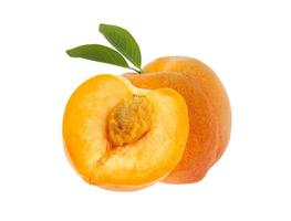 Peach fruit one cut in half with green leaf isolated on white background photo