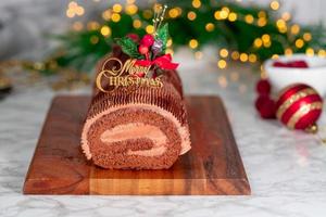 Traditional Christmas cake, chocolate Yule log with festive decorations photo