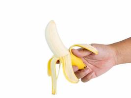 Hand holding 1 banana, ripe golden yellow The ready-to-eat casing is rich in nutrients. Great effect shot in a studio on a white background with clipping paths and copy space isolated. photo