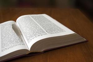 open book lying on the table photo