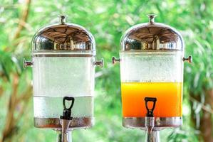 fresh orange juice from fresh orange with high vitamin c from farm in pitcher or jar for freshness in morning with breakfast in restaurang hotel and resort for healthy photo