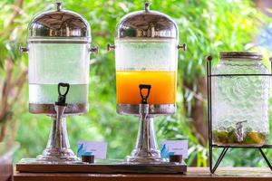 fresh orange juice from fresh orange with high vitamin c from farm in pitcher or jar for freshness in morning with breakfast in restaurang hotel and resort for healthy photo