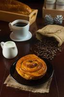 Different kinds of fresh bread on wooden table photo