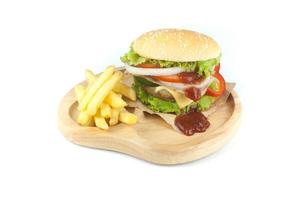 Pork hamburger Homemade with grilled bacon contains vegetables, cheese, lettuce, onion, chilli, spices in a wooden dish isolated on white backgroud photo