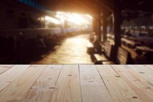 Empty table in front of blurry train station with abstract background Ready for Create montage product display or design key visual layout banner or panoramic photo