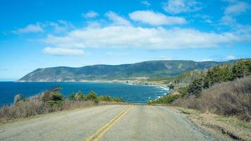 View of the mountain seen through the road Cape Breton, Nova Scotia, Canada photo