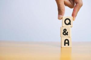 Close-up Shot of Q and A wooden blocks. photo