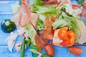 organic vegetables waste against blue wooden surface photo