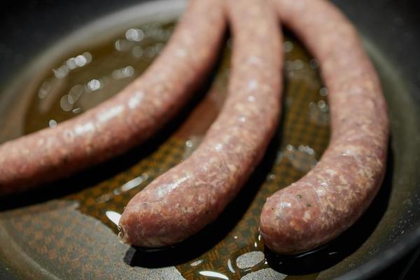 Bratwurst Stock Photos Images And Backgrounds For Free Download Close Up Of German Bratwurst In A Pan Photo