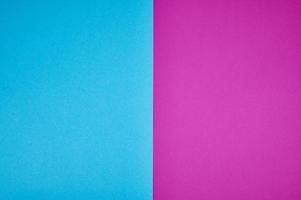 blue and magenta colored papers laid together as background photo with copy space