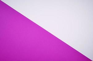 magenta and white colored paper laid diagonal together as background photo