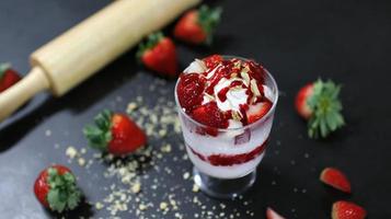 strawberry mini bingsu on black table photo