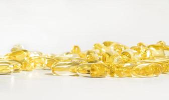 Food supplement oil filled fish oil, vitamin D, omega 3, omega 6, vitamin A, vitamin E, flaxseed oil. photo