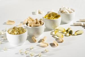 Food supplement oil filled fish oil, vitamin D, omega 3, omega 6, vitamin A, vitamin E, flaxseed oil. photo