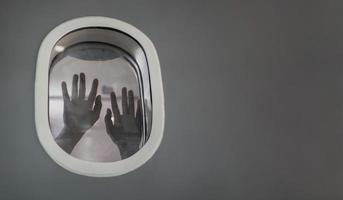 Passenger suffocating and asking for help while stuck inside the airplane after catastrophic accident for plane crash and hijack concept with copy space photo